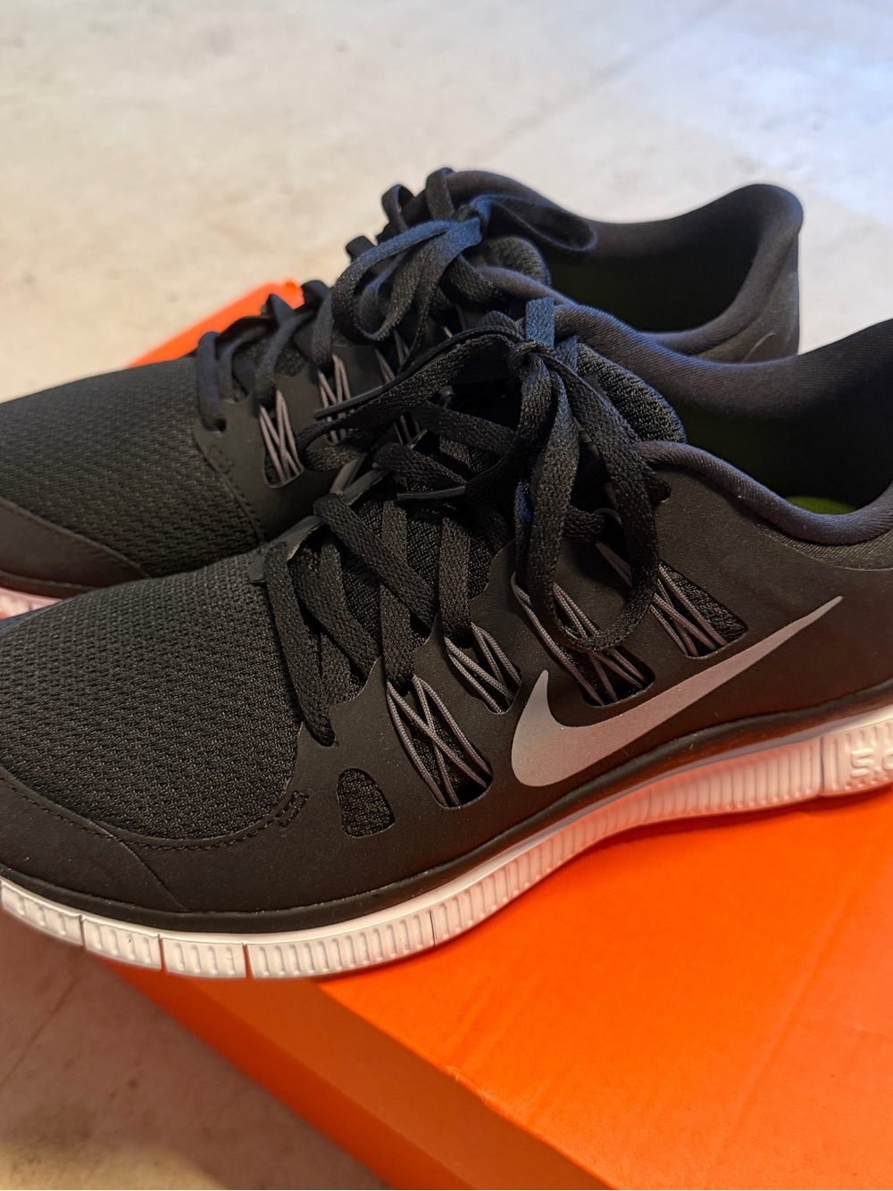Nike Men’s Black Athletic Sneakers with White Swoosh